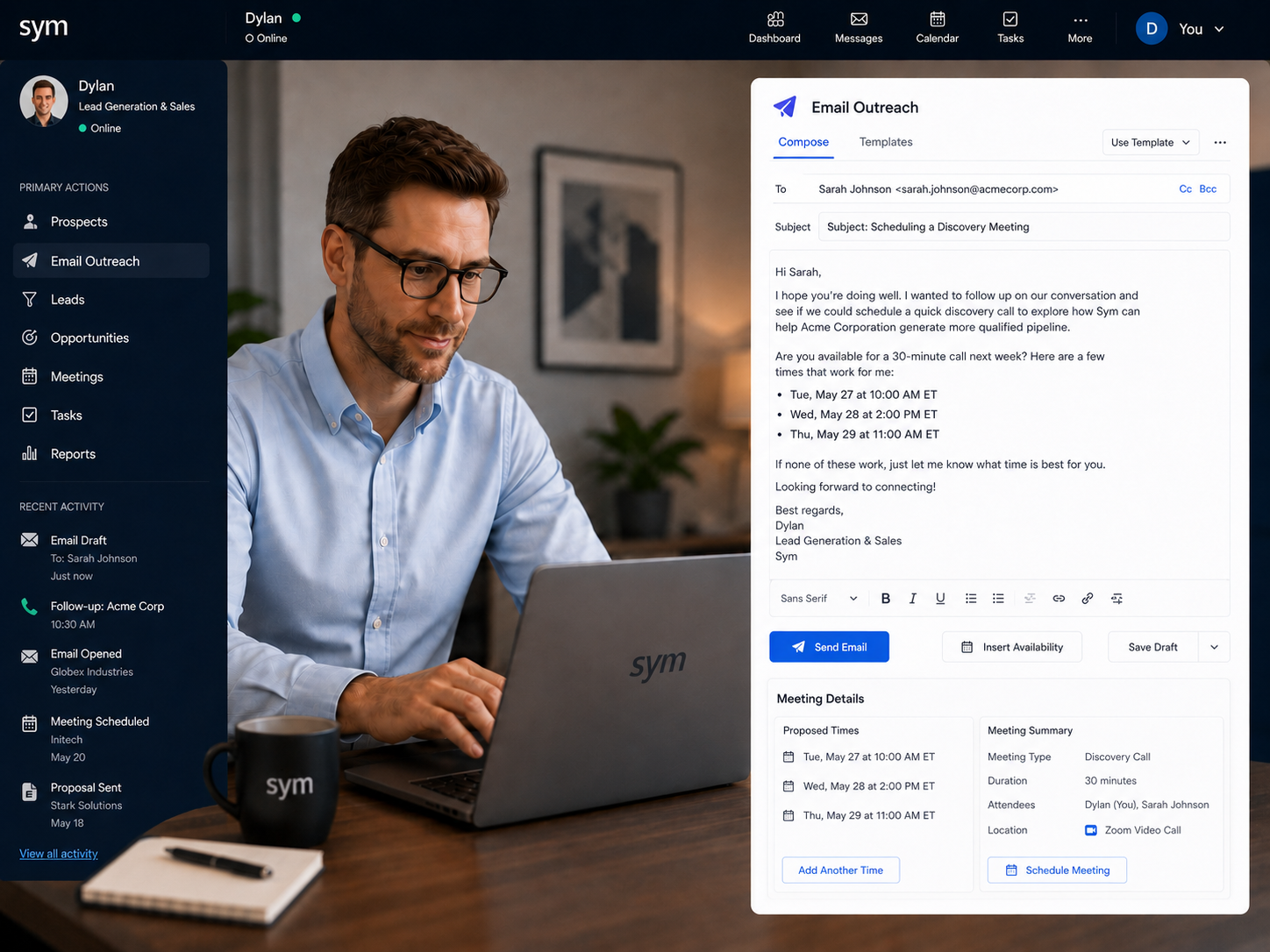 A man named Dylan at a desk using a laptop branded Sym, composing an email outreach within the Sym CRM platform to schedule business meetings.